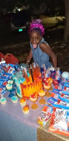 Birthday girl at a custom dessert display