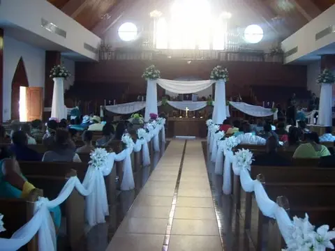 Church wedding aisle decorated in white
