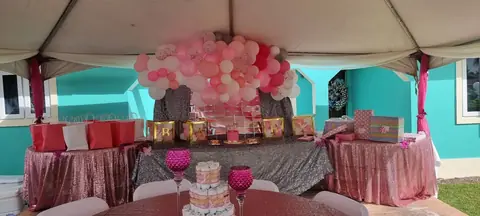 Pink baby shower balloon and gift display
