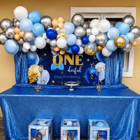 Blue silver white and gold ONEderful first birthday balloon and dessert setup